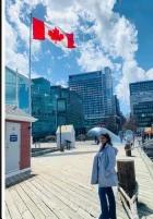 A VanHacker holding a Canadian flag